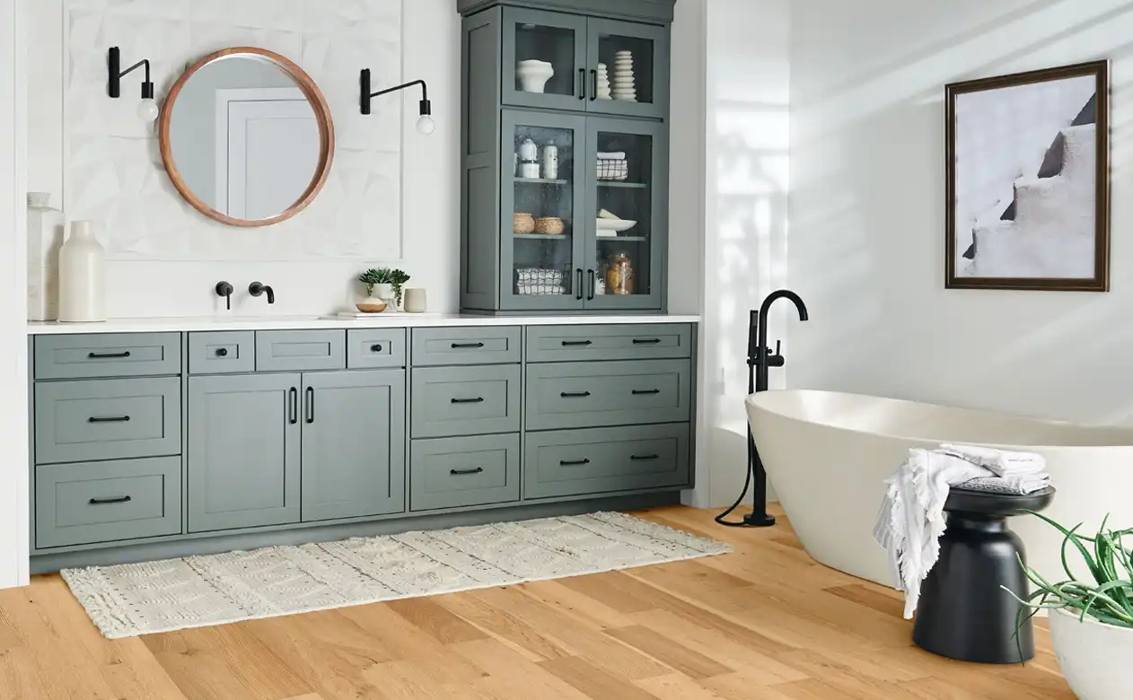 Wood look bathroom flooring with standing tub. 